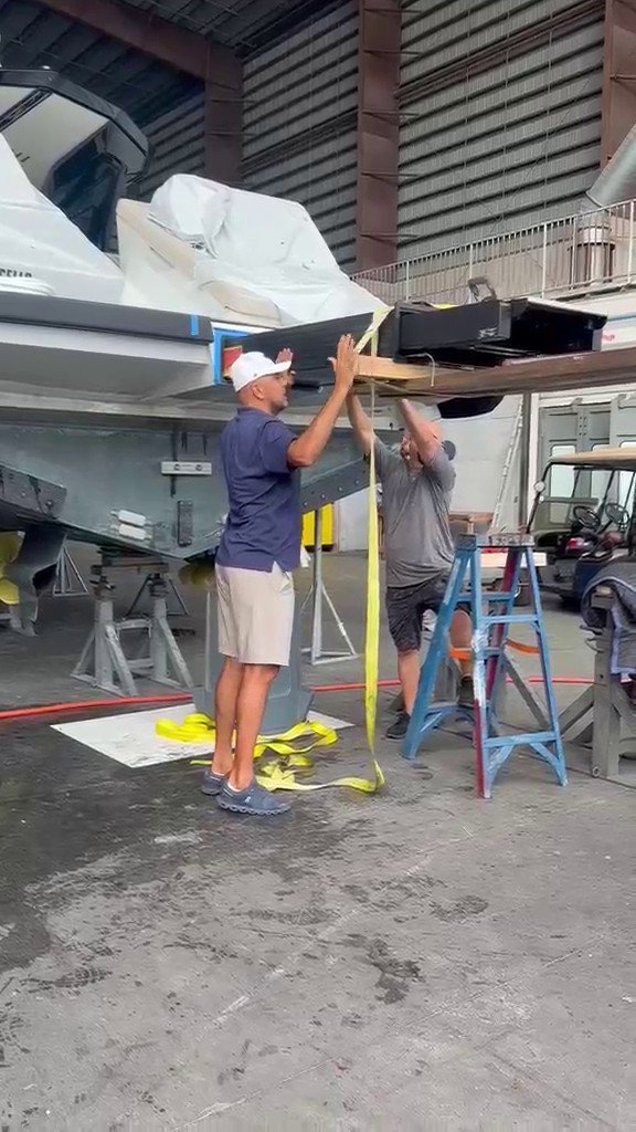 Boatique technicians installing a Besenzoni gangway at the shipyard