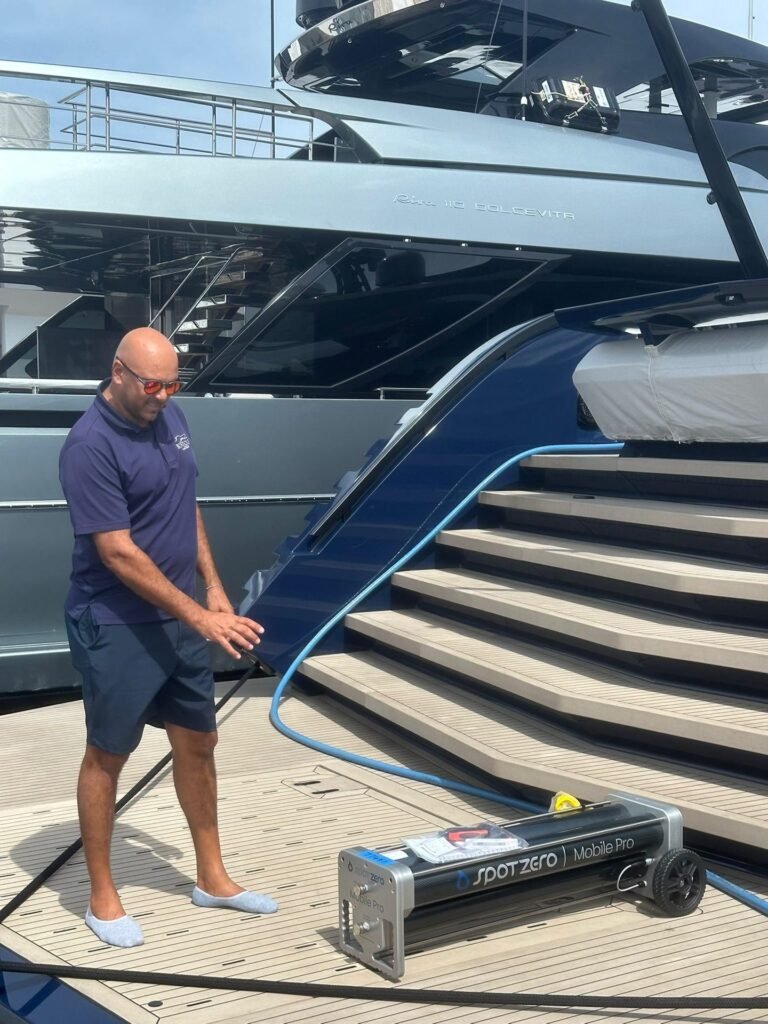 Boatique technician installing equipment aboard a superyacht