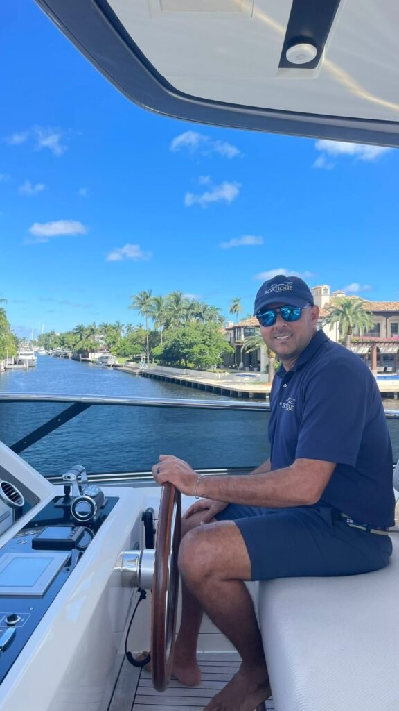 Boatique captain at the helm during a sea trial in Fort Lauderdale